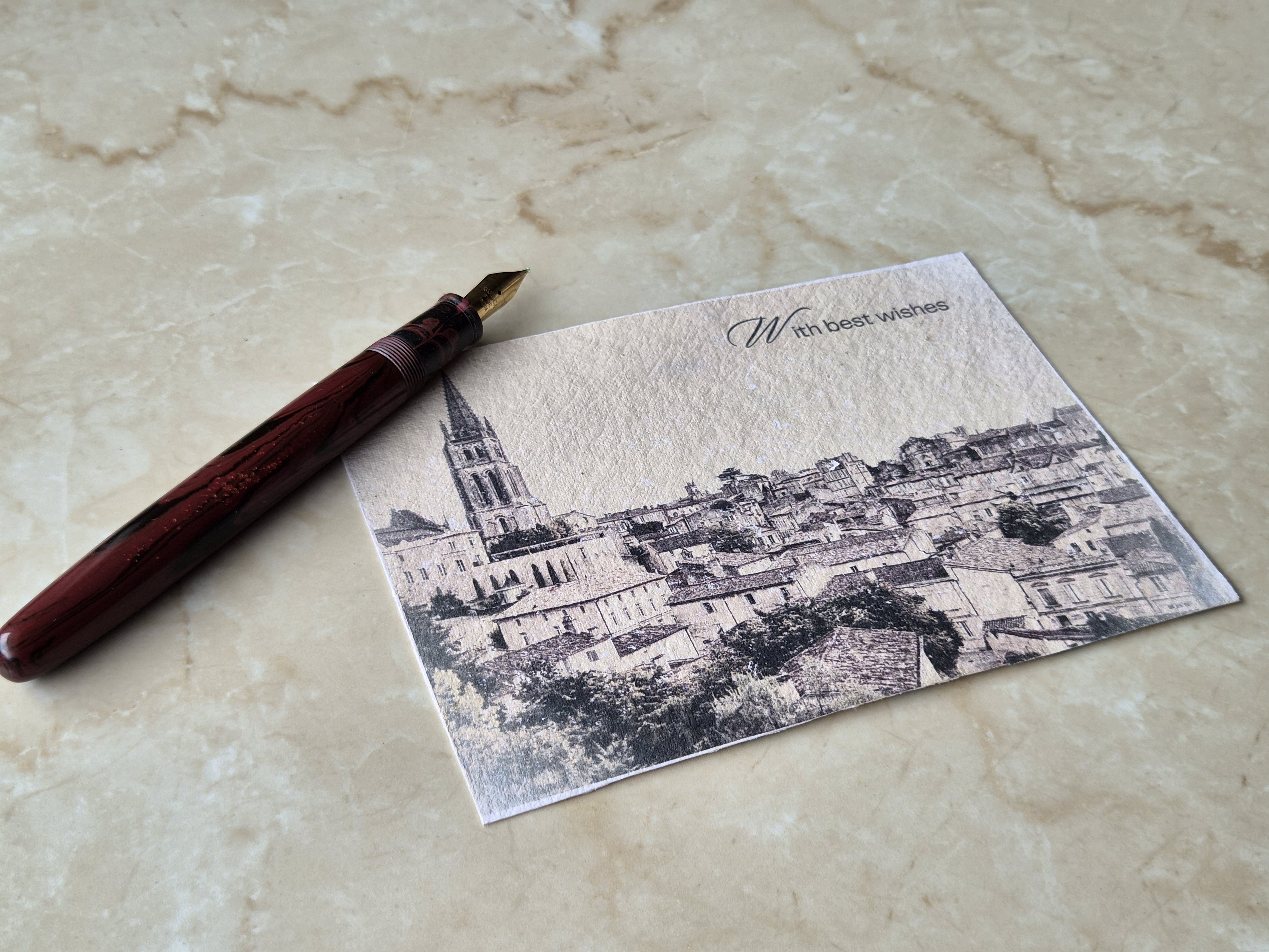 Cityscape handmade paper postcard — hero