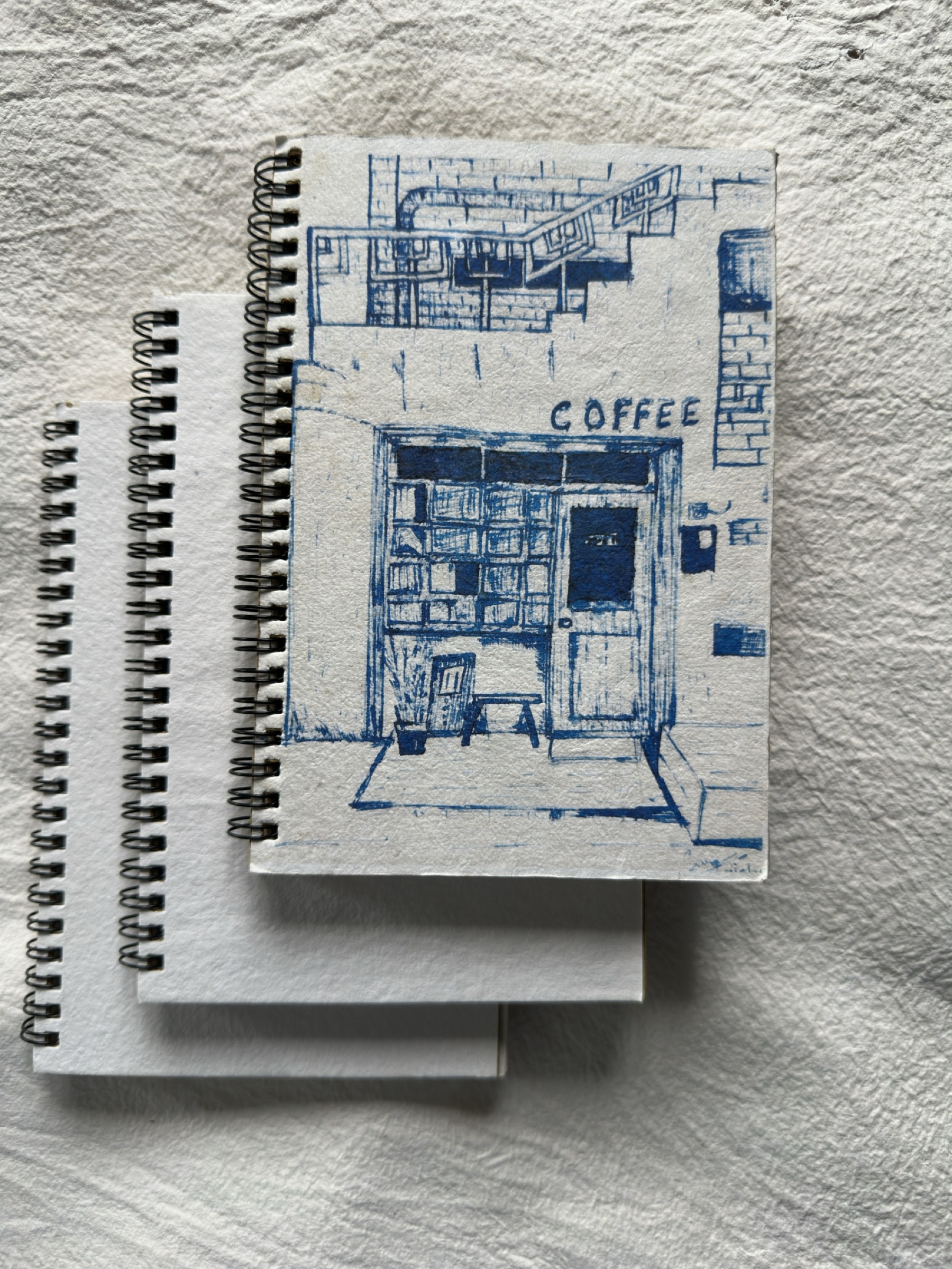Blue coffee-cover spiral notebook — hero