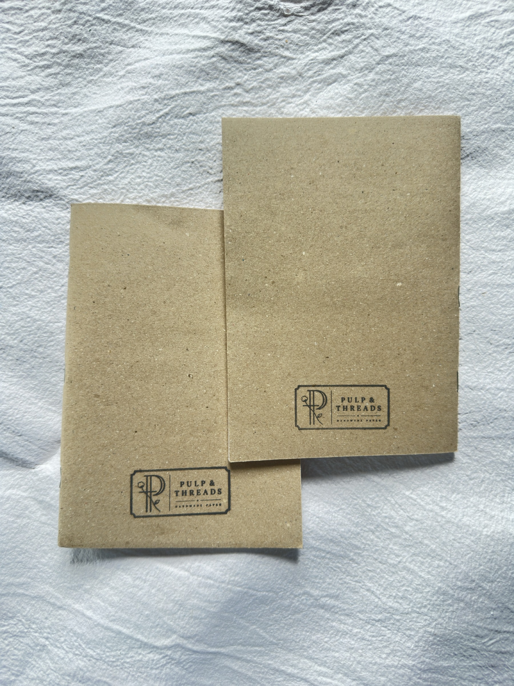 Brown paper cover stapled notebook — hero