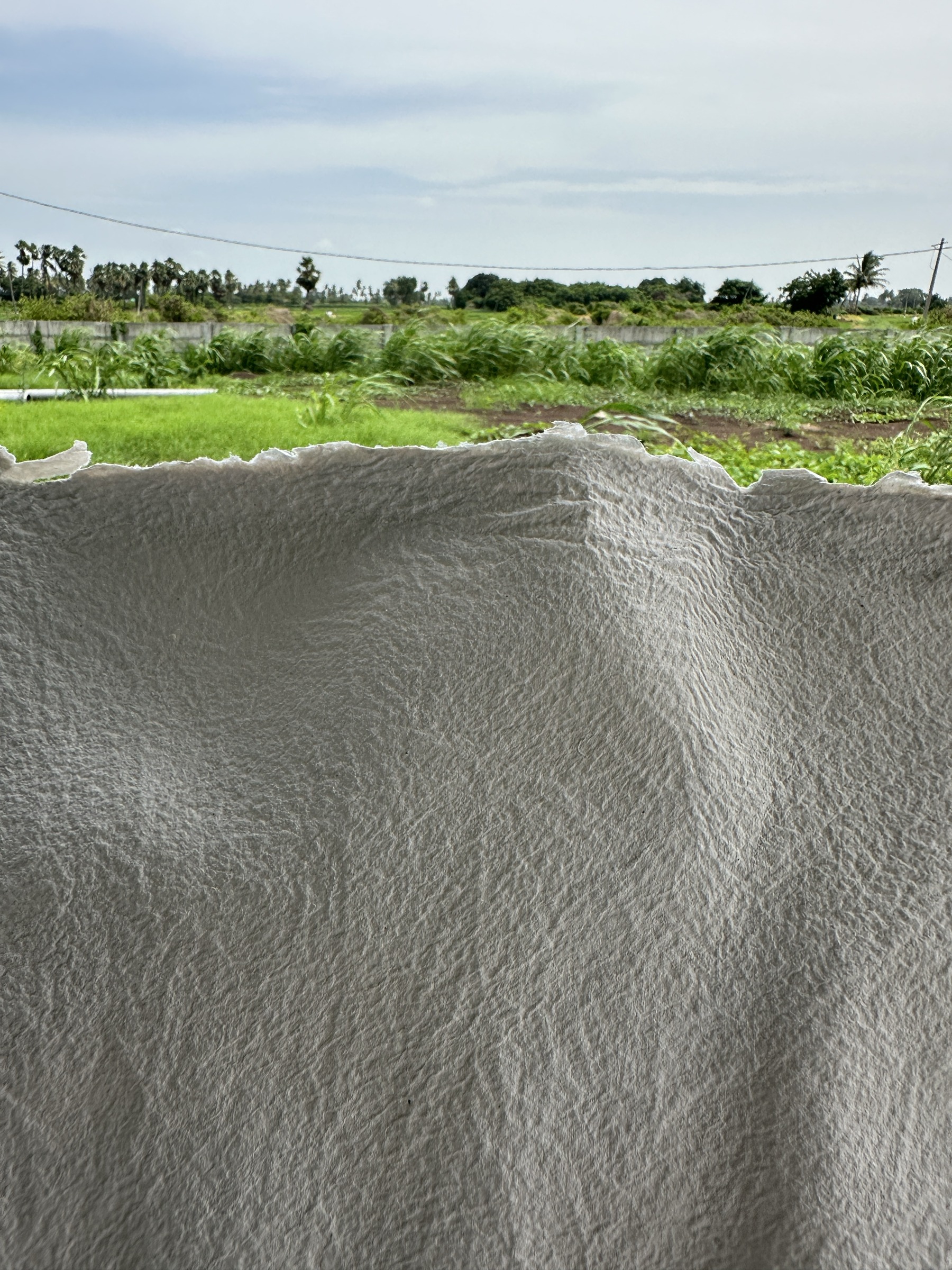 White textured handmade paper with deckled edge by Pulp & Threads
